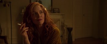 Movie still from “French Exit” (2020), directed by Azazel Jacobs – A woman with red hair sitting in a living room; Close Up shot, Over the shoulder angle