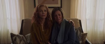 Movie still from “French Exit” (2020), directed by Azazel Jacobs – Two women sitting next to each other on a couch; Medium shot, Low angle
