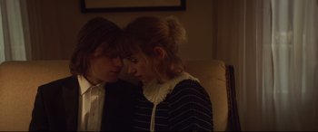 Movie still from “French Exit” (2020), directed by Azazel Jacobs – A couple of people sitting on top of a couch; Close Up shot, High angle