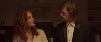 Movie still from “French Exit” (2020), directed by Azazel Jacobs – A man and a woman standing next to each other in a kitchen; Close Up shot, Over the shoulder angle
