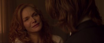 Movie still from “French Exit” (2020), directed by Azazel Jacobs – A person looking at a mirror; Close Up shot, Over the shoulder angle