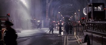 Movie still from “Frequency” (2000), directed by Gregory Hoblit – A group of firemen are walking down the street; Extreme Wide shot, High angle