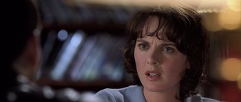 Movie still from “Frequency” (2000), directed by Gregory Hoblit – A person with short brown hair; Close Up shot, Over the shoulder angle