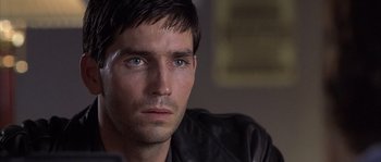 Movie still from “Frequency” (2000), directed by Gregory Hoblit – A person wearing a leather jacket; Close Up shot, Over the shoulder angle
