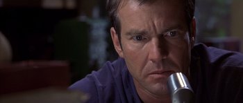 Movie still from “Frequency” (2000), directed by Gregory Hoblit – A person looking at the camera; Close Up shot, Low angle