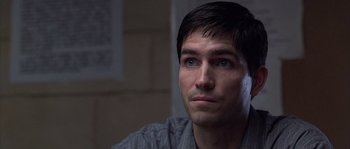 Movie still from “Frequency” (2000), directed by Gregory Hoblit – A person looking at the camera; Close Up shot, Over the shoulder angle