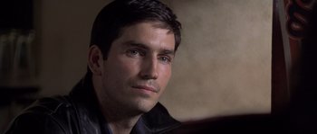 Movie still from “Frequency” (2000), directed by Gregory Hoblit – A person wearing a black jacket; Close Up shot, Over the shoulder angle