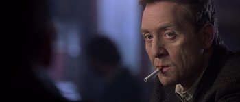 Movie still from “Frequency” (2000), directed by Gregory Hoblit – A person with a cigarette in his mouth; Close Up shot, Low angle