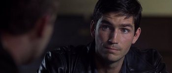 Movie still from “Frequency” (2000), directed by Gregory Hoblit – A person wearing a leather jacket; Close Up shot, Over the shoulder angle