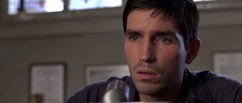 Movie still from “Frequency” (2000), directed by Gregory Hoblit – A person with a microphone; Close Up shot, Over the shoulder angle