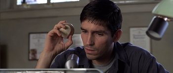 Movie still from “Frequency” (2000), directed by Gregory Hoblit – A person holding a baseball; Close Up shot, High angle