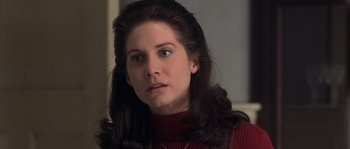 Movie still from “Frequency” (2000), directed by Gregory Hoblit – A person with long hair; Close Up shot, High angle