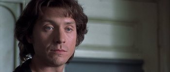 Movie still from “Frequency” (2000), directed by Gregory Hoblit – A person's face in a room; Close Up shot, Low angle