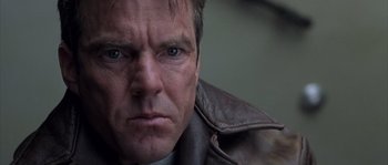 Movie still from “Frequency” (2000), directed by Gregory Hoblit – A person wearing a leather jacket; Close Up shot, Low angle
