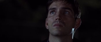 Movie still from “Frequency” (2000), directed by Gregory Hoblit – A man's face in the dark; Close Up shot, Low angle