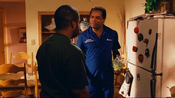 Movie still from “Friday” (1995), directed by F. Gary Gray – Two men standing in front of a refrigerator; Medium shot, Over the shoulder angle