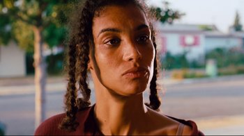 Movie still from “Friday” (1995), directed by F. Gary Gray – A person with dreadlocks; Close Up shot, Low angle