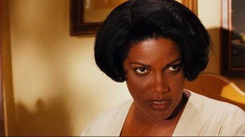 Movie still from “Friday” (1995), directed by F. Gary Gray – A person wearing a white shirt; Close Up shot, Over the shoulder angle