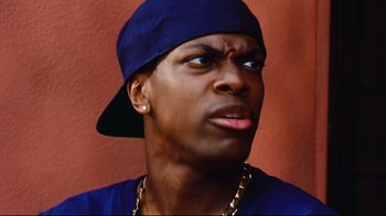 Movie still from “Friday” (1995), directed by F. Gary Gray – A person wearing a hat; Close Up shot, Low angle