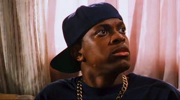 Movie still from “Friday” (1995), directed by F. Gary Gray – A person wearing a hat; Close Up shot, Low angle