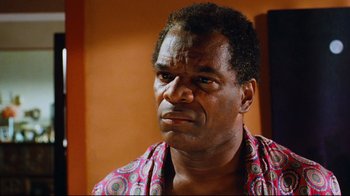Movie still from “Friday” (1995), directed by F. Gary Gray – An older man with a serious look on his face; Close Up shot, Low angle