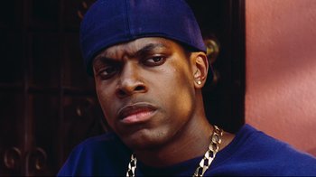 Movie still from “Friday” (1995), directed by F. Gary Gray – A person wearing a hat; Close Up shot, Low angle