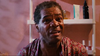 Movie still from “Friday” (1995), directed by F. Gary Gray – An older black man with an expression of sadness; Close Up shot, High angle