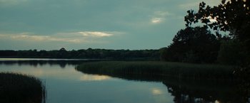 Movie still from “Friday the 13th” (2009), directed by Marcus Nispel – A body of water with trees in the background; Extreme Wide shot, High angle