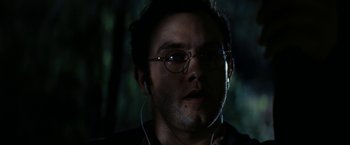 Movie still from “Friday the 13th” (2009), directed by Marcus Nispel – A person wearing glasses and headphones; Close Up shot, Over the shoulder angle