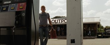 Movie still from “Friday the 13th” (2009), directed by Marcus Nispel – A man walking down the street holding a bag; Wide shot, Over the shoulder angle