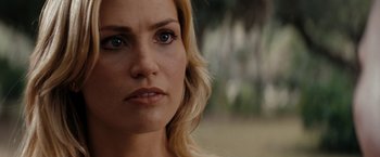 Movie still from “Friday the 13th” (2009), directed by Marcus Nispel – A woman's face with a blurry background; Close Up shot, Over the shoulder angle