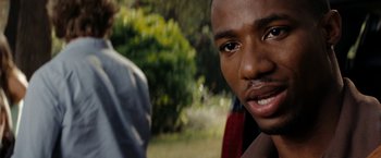 Movie still from “Friday the 13th” (2009), directed by Marcus Nispel – A man's face in front of another man; Close Up shot, Over the shoulder angle