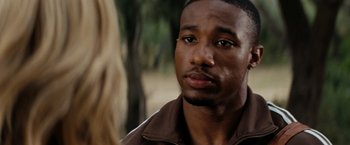 Movie still from “Friday the 13th” (2009), directed by Marcus Nispel – A person wearing a brown jacket; Close Up shot, Over the shoulder angle