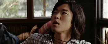 Movie still from “Friday the 13th” (2009), directed by Marcus Nispel – A man with long black hair looking up at the sky; Close Up shot, Low angle