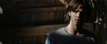 Movie still from “Friday the 13th” (2009), directed by Marcus Nispel – A person with long brown hair; Close Up shot, Over the shoulder angle