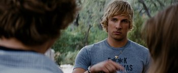 Movie still from “Friday the 13th” (2009), directed by Marcus Nispel – Two young men are talking in a wooded area; Close Up shot, Over the shoulder angle