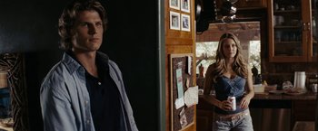Movie still from “Friday the 13th” (2009), directed by Marcus Nispel – A man and a woman standing next to each other in a room; Medium shot, Over the shoulder angle