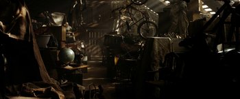 Movie still from “Friday the 13th” (2009), directed by Marcus Nispel – A bicycle parked on top of a table in a room; Wide shot, High angle