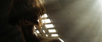 Movie still from “Friday the 13th” (2009), directed by Marcus Nispel – A woman with red hair is in the sunlight; Close Up shot, Low angle