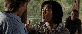 Movie still from “Friday the 13th” (2009), directed by Marcus Nispel – A man in a plaid shirt talking to another man in a plaid shirt; Close Up shot, Over the shoulder angle