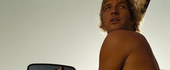 Movie still from “Friday the 13th” (2009), directed by Marcus Nispel – A person holding a cell phone; Close Up shot, Low angle