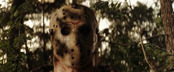 Movie still from “Friday the 13th” (2009), directed by Marcus Nispel – The face of a person wearing a hockey mask; Close Up shot, Low angle