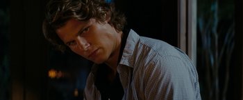 Movie still from “Friday the 13th” (2009), directed by Marcus Nispel – A person wearing a shirt and a tie; Close Up shot, Over the shoulder angle