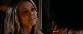 Movie still from “Friday the 13th” (2009), directed by Marcus Nispel – A beautiful woman holding a glass of wine; Close Up shot, Over the shoulder angle