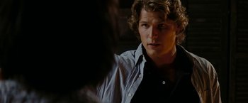 Movie still from “Friday the 13th” (2009), directed by Marcus Nispel – A person wearing a button up shirt; Close Up shot, Over the shoulder angle