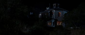 Movie still from “Friday the 13th” (2009), directed by Marcus Nispel – A house that is lit up at night time; Extreme Wide shot, High angle