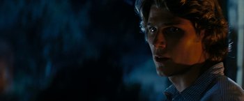 Movie still from “Friday the 13th” (2009), directed by Marcus Nispel – A man's face in the dark; Close Up shot, Over the shoulder angle