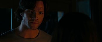 Movie still from “Friday the 13th” (2009), directed by Marcus Nispel – A person in a dark room; Close Up shot, Over the shoulder angle