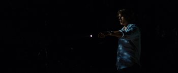 Movie still from “Friday the 13th” (2009), directed by Marcus Nispel – A man in a blue shirt is pointing at a purple ball; Medium shot, Over the shoulder angle