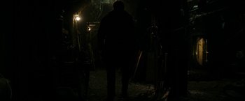 Movie still from “Friday the 13th” (2009), directed by Marcus Nispel – A man standing in the dark in front of a light; Wide shot, Low angle